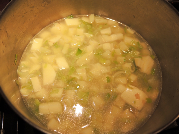 Potatoes added to Leeks and Broth for Man Fuel's Potato Leek Soup